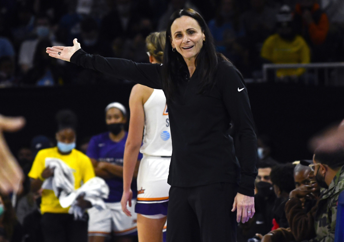 Sandy Brondello raising her right arm in confusion